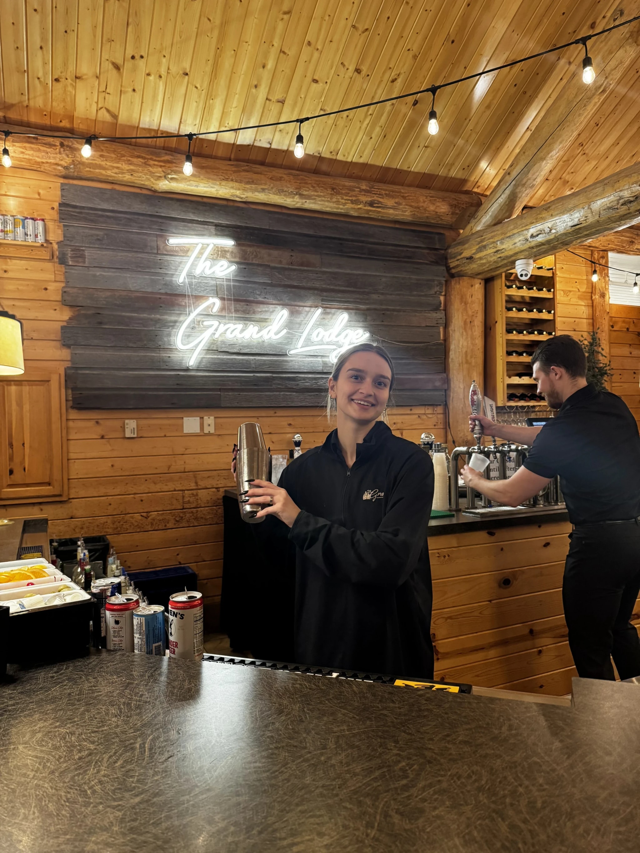 Bartender mixing a drink at the reception bar